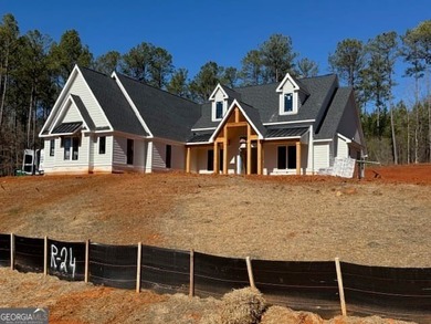 Luxury living awaits in River Forest, a premier swim, golf, and on The Club River Forest in Georgia - for sale on GolfHomes.com, golf home, golf lot