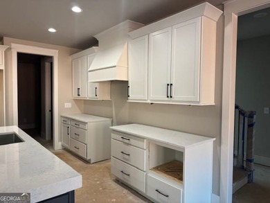 Luxury living awaits in River Forest, a premier swim, golf, and on The Club River Forest in Georgia - for sale on GolfHomes.com, golf home, golf lot