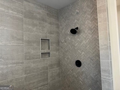 Luxury living awaits in River Forest, a premier swim, golf, and on The Club River Forest in Georgia - for sale on GolfHomes.com, golf home, golf lot