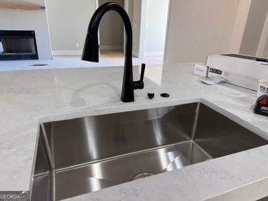 Luxury living awaits in River Forest, a premier swim, golf, and on The Club River Forest in Georgia - for sale on GolfHomes.com, golf home, golf lot