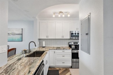 Exceptional craftsmanship and stunning upgrades make this a on Isla Del Sol Yacht and Country Club in Florida - for sale on GolfHomes.com, golf home, golf lot