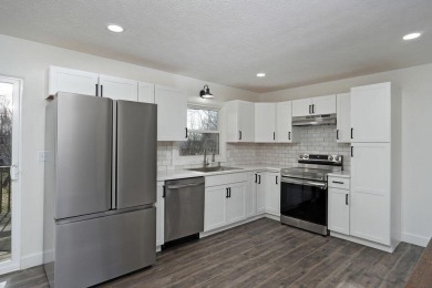 Beautifully renovated and perfectly located near Horton Smith on Horton Smith Golf Course in Missouri - for sale on GolfHomes.com, golf home, golf lot