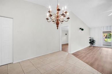 Welcome to this beautifully updated villa in Palm Harbor's on Highland Lakes Executive Golf Course in Florida - for sale on GolfHomes.com, golf home, golf lot