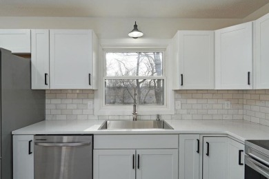 Beautifully renovated and perfectly located near Horton Smith on Horton Smith Golf Course in Missouri - for sale on GolfHomes.com, golf home, golf lot