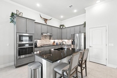 Step into resort-style living in this like-new 2 bedroom, 2.5 on Wildhorse Golf Club of Robson Ranch in Texas - for sale on GolfHomes.com, golf home, golf lot
