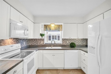 Welcome to this beautifully updated villa in Palm Harbor's on Highland Lakes Executive Golf Course in Florida - for sale on GolfHomes.com, golf home, golf lot
