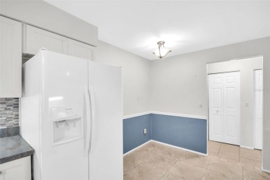 Welcome to this beautifully updated villa in Palm Harbor's on Highland Lakes Executive Golf Course in Florida - for sale on GolfHomes.com, golf home, golf lot