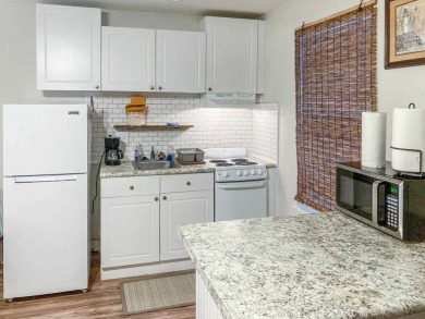 Charming Townhome with Carriage House in Desirable Southwood on Southwood Golf Club in Florida - for sale on GolfHomes.com, golf home, golf lot