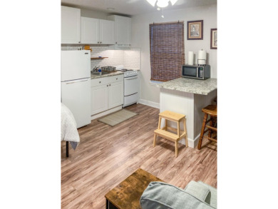 Charming Townhome with Carriage House in Desirable Southwood on Southwood Golf Club in Florida - for sale on GolfHomes.com, golf home, golf lot