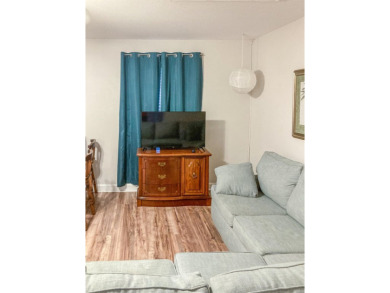 Charming Townhome with Carriage House in Desirable Southwood on Southwood Golf Club in Florida - for sale on GolfHomes.com, golf home, golf lot