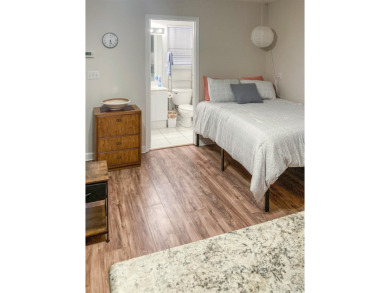 Charming Townhome with Carriage House in Desirable Southwood on Southwood Golf Club in Florida - for sale on GolfHomes.com, golf home, golf lot