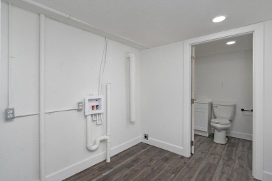 Beautifully renovated and perfectly located near Horton Smith on Horton Smith Golf Course in Missouri - for sale on GolfHomes.com, golf home, golf lot
