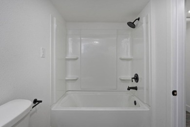 Beautifully renovated and perfectly located near Horton Smith on Horton Smith Golf Course in Missouri - for sale on GolfHomes.com, golf home, golf lot