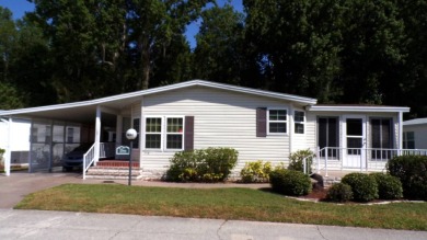 This lovely Palm Harbor home offers a spacious and cozy living on Schalamar Creek Golf and Country Club in Florida - for sale on GolfHomes.com, golf home, golf lot