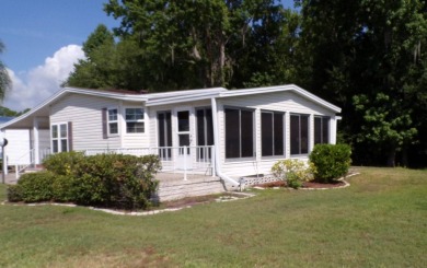 This lovely Palm Harbor home offers a spacious and cozy living on Schalamar Creek Golf and Country Club in Florida - for sale on GolfHomes.com, golf home, golf lot