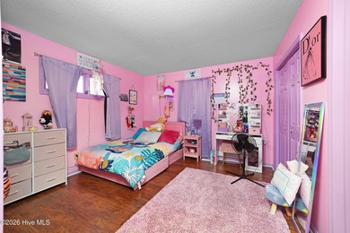 Tucked away on a wooded lot in Fairfield Harbour, this inviting on Harbour Point Golf Club in North Carolina - for sale on GolfHomes.com, golf home, golf lot