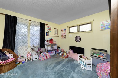 Tucked away on a wooded lot in Fairfield Harbour, this inviting on Harbour Point Golf Club in North Carolina - for sale on GolfHomes.com, golf home, golf lot