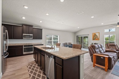 Welcome to 4 Eastmoor Ln, Palm Coast, FL 32164, an inviting and on The Grand Club Cypress Course in Florida - for sale on GolfHomes.com, golf home, golf lot