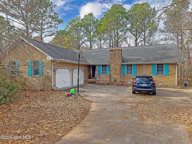 Tucked away on a wooded lot in Fairfield Harbour, this inviting on Harbour Point Golf Club in North Carolina - for sale on GolfHomes.com, golf home, golf lot