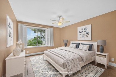 SPACIOUS FIRST FLOOR CORNER UNIT FILLED WITH NATURAL LIGHT on BallenIsles Golf and Country Club in Florida - for sale on GolfHomes.com, golf home, golf lot