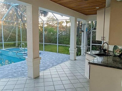 Listen to the waves crashing on the beach from this custom pool on Hammock Dunes Club in Florida - for sale on GolfHomes.com, golf home, golf lot