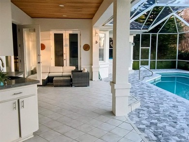 Listen to the waves crashing on the beach from this custom pool on Hammock Dunes Club in Florida - for sale on GolfHomes.com, golf home, golf lot
