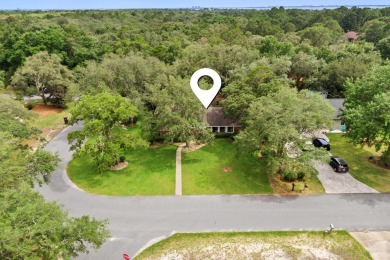 Nestled on a spacious 1/3-acre corner lot backing to a peaceful on Golf Club at Bluewater Bay Resort in Florida - for sale on GolfHomes.com, golf home, golf lot