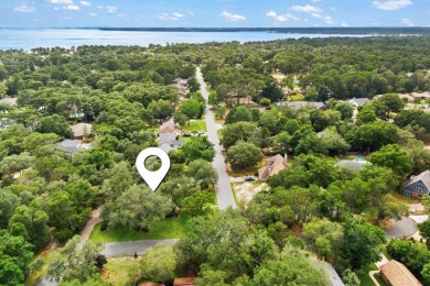 Nestled on a spacious 1/3-acre corner lot backing to a peaceful on Golf Club at Bluewater Bay Resort in Florida - for sale on GolfHomes.com, golf home, golf lot