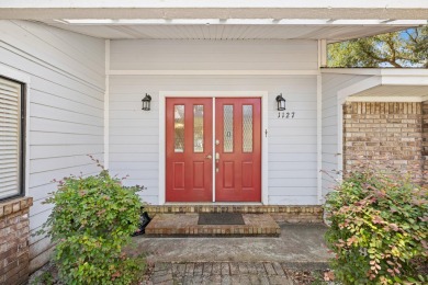 Nestled on a spacious 1/3-acre corner lot backing to a peaceful on Golf Club at Bluewater Bay Resort in Florida - for sale on GolfHomes.com, golf home, golf lot