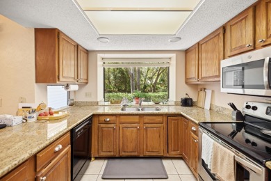 Nestled on a spacious 1/3-acre corner lot backing to a peaceful on Golf Club at Bluewater Bay Resort in Florida - for sale on GolfHomes.com, golf home, golf lot