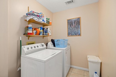 Nestled on a spacious 1/3-acre corner lot backing to a peaceful on Golf Club at Bluewater Bay Resort in Florida - for sale on GolfHomes.com, golf home, golf lot