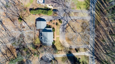 Nestled alongside the picturesque 7th fairway at Forest Oaks on Forest Oaks Country Club in North Carolina - for sale on GolfHomes.com, golf home, golf lot