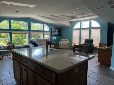 ENJOY PEACEFUL WATERFRONT LIVING IN THIS BRIGHT AND SPACIOUS on Schalamar Creek Golf and Country Club in Florida - for sale on GolfHomes.com, golf home, golf lot