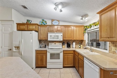 This one is truly a MUST-SEE!!! Welcome to this charming on Orange Blossom Hills Golf and Country Club in Florida - for sale on GolfHomes.com, golf home, golf lot