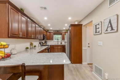 Beautifully updated Woodmist model in the desirable gated on Spring Lake Golf Club - Thunderbird in New York - for sale on GolfHomes.com, golf home, golf lot
