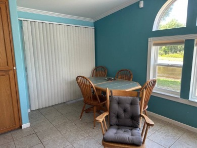 ENJOY PEACEFUL WATERFRONT LIVING IN THIS BRIGHT AND SPACIOUS on Schalamar Creek Golf and Country Club in Florida - for sale on GolfHomes.com, golf home, golf lot