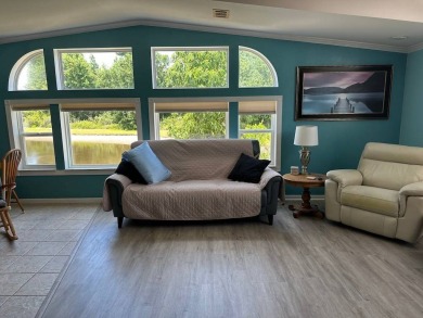 ENJOY PEACEFUL WATERFRONT LIVING IN THIS BRIGHT AND SPACIOUS on Schalamar Creek Golf and Country Club in Florida - for sale on GolfHomes.com, golf home, golf lot