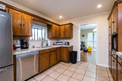 This mid-century, single-level home sits on a spacious half acre on Maumelle Golf and Country Club in Arkansas - for sale on GolfHomes.com, golf home, golf lot