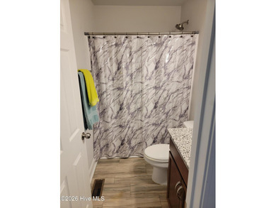 Custom home on huge lot with NO HOA and water view of Paradise on The Lakes Country Club in North Carolina - for sale on GolfHomes.com, golf home, golf lot