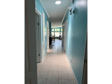 ENJOY PEACEFUL WATERFRONT LIVING IN THIS BRIGHT AND SPACIOUS on Schalamar Creek Golf and Country Club in Florida - for sale on GolfHomes.com, golf home, golf lot