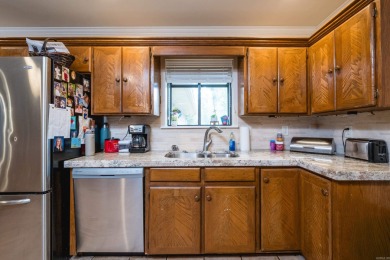 This mid-century, single-level home sits on a spacious half acre on Maumelle Golf and Country Club in Arkansas - for sale on GolfHomes.com, golf home, golf lot