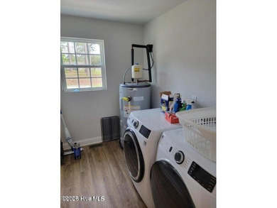 Custom home on huge lot with NO HOA and water view of Paradise on The Lakes Country Club in North Carolina - for sale on GolfHomes.com, golf home, golf lot