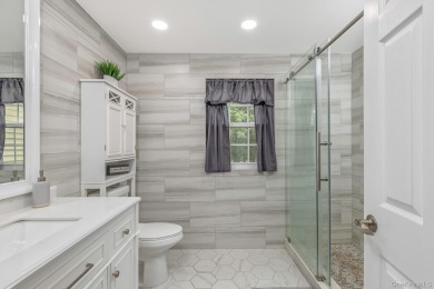 Beautifully updated Woodmist model in the desirable gated on Spring Lake Golf Club - Thunderbird in New York - for sale on GolfHomes.com, golf home, golf lot