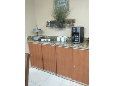 Beautiful, immaculate first floor corner unit, large open on Indian Spring Golf and Country Club in Florida - for sale on GolfHomes.com, golf home, golf lot
