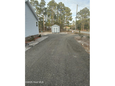 Custom home on huge lot with NO HOA and water view of Paradise on The Lakes Country Club in North Carolina - for sale on GolfHomes.com, golf home, golf lot