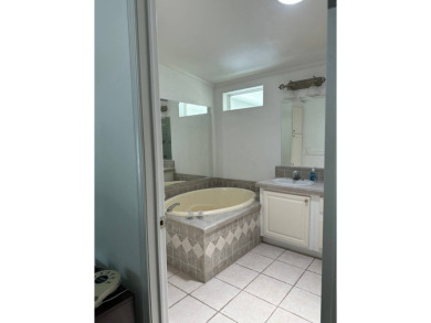 ENJOY PEACEFUL WATERFRONT LIVING IN THIS BRIGHT AND SPACIOUS on Schalamar Creek Golf and Country Club in Florida - for sale on GolfHomes.com, golf home, golf lot
