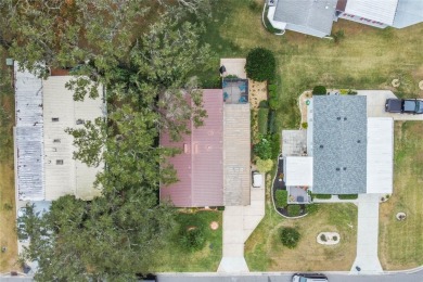 This one is truly a MUST-SEE!!! Welcome to this charming on Orange Blossom Hills Golf and Country Club in Florida - for sale on GolfHomes.com, golf home, golf lot
