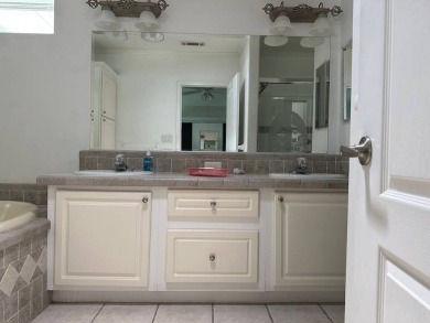 ENJOY PEACEFUL WATERFRONT LIVING IN THIS BRIGHT AND SPACIOUS on Schalamar Creek Golf and Country Club in Florida - for sale on GolfHomes.com, golf home, golf lot