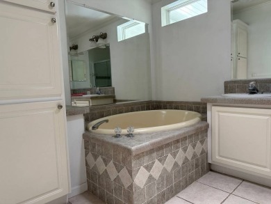 ENJOY PEACEFUL WATERFRONT LIVING IN THIS BRIGHT AND SPACIOUS on Schalamar Creek Golf and Country Club in Florida - for sale on GolfHomes.com, golf home, golf lot