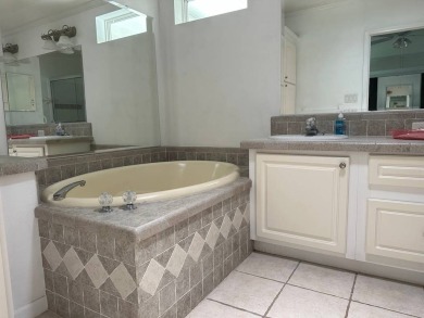 ENJOY PEACEFUL WATERFRONT LIVING IN THIS BRIGHT AND SPACIOUS on Schalamar Creek Golf and Country Club in Florida - for sale on GolfHomes.com, golf home, golf lot